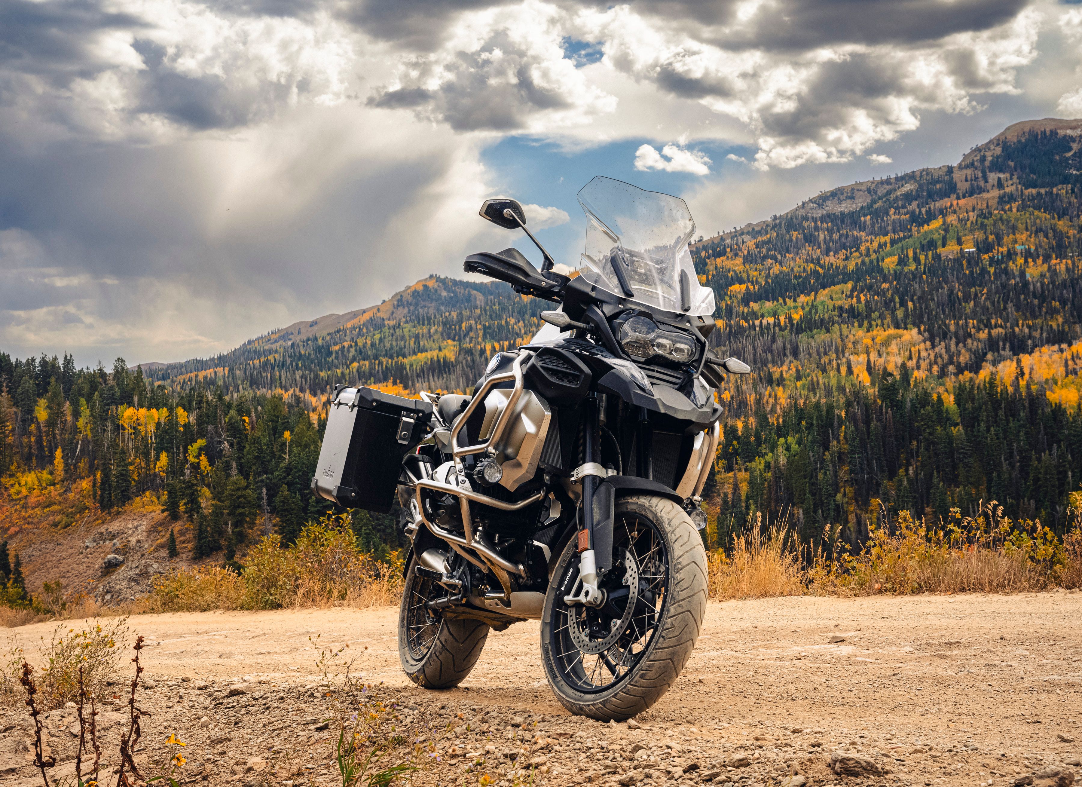 Adventure motorcycle with aluminum panniers on a mountain trail
